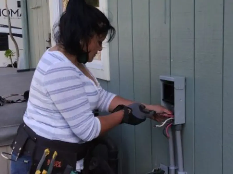 Licensed electrician wiring an exterior subpanel in Chantilly